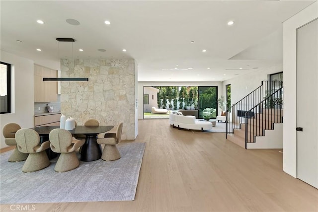 14738 Otsego St, Sherman Oaks, CA 91403 - dining area featuring light wood finished floors, recessed lighting, and stairway