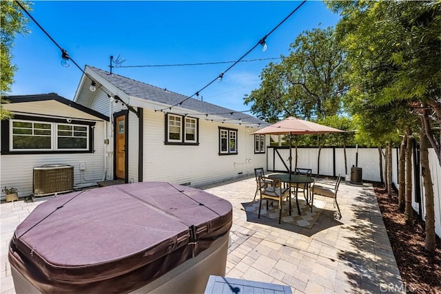 705 E Palm Ave, Orange, CA 92866 - fenced backyard featuring a hot tub, a patio area, and outdoor dining space