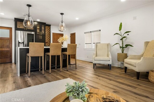 705 E Palm Ave, Orange, CA 92866 - dining room featuring recessed lighting, crown molding, and wood finished floors