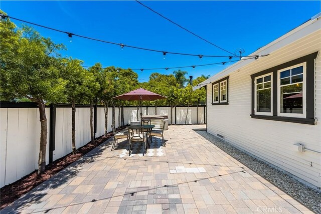 705 E Palm Ave, Orange, CA 92866 - fenced backyard with a patio and outdoor dining area