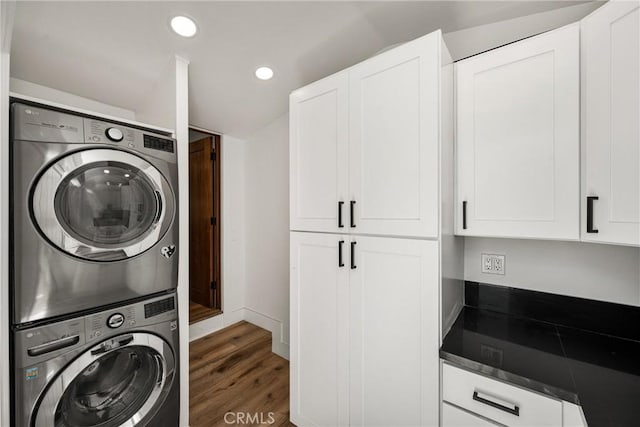 705 E Palm Ave, Orange, CA 92866 - washroom with stacked washer and clothes dryer, wood finished floors, recessed lighting, and cabinet space