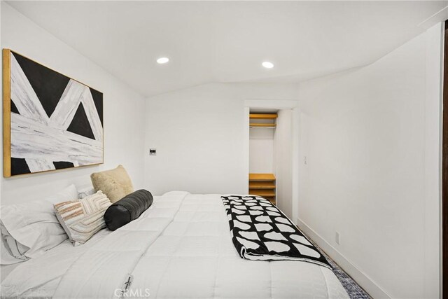 705 E Palm Ave, Orange, CA 92866 - bedroom featuring recessed lighting, vaulted ceiling, and a spacious closet