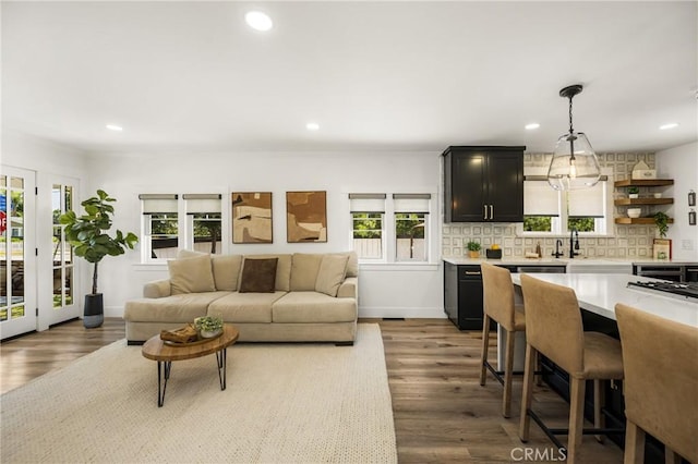 705 E Palm Ave, Orange, CA 92866 - living room featuring plenty of natural light, recessed lighting, and wood finished floors