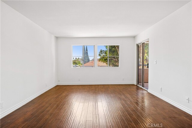 1629 Cherry Ave Unit 102, Long Beach, CA 90813 - empty room with hardwood / wood-style flooring and baseboards