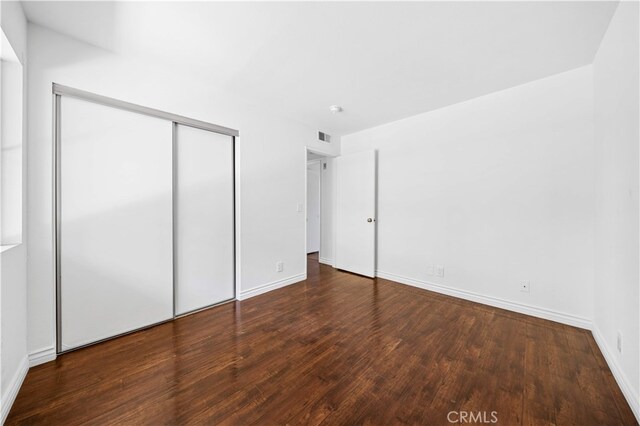 1629 Cherry Ave Unit 102, Long Beach, CA 90813 - unfurnished bedroom featuring wood finished floors and a closet