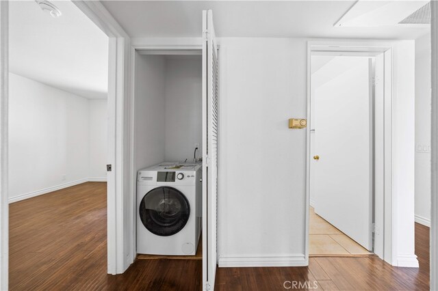 1629 Cherry Ave Unit 102, Long Beach, CA 90813 - laundry area with washer / dryer and wood finished floors