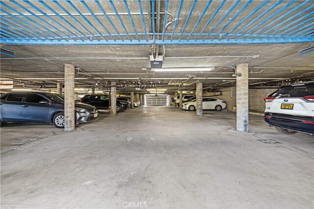 1629 Cherry Ave Unit 102, Long Beach, CA 90813 - parking deck featuring a garage door opener