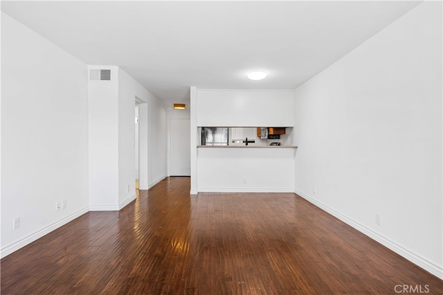 1629 Cherry Ave Unit 102, Long Beach, CA 90813 - unfurnished living room with hardwood / wood-style flooring and baseboards