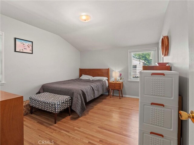 1511 N Maple St, Burbank, CA 91505 - bedroom with light wood-type flooring and vaulted ceiling