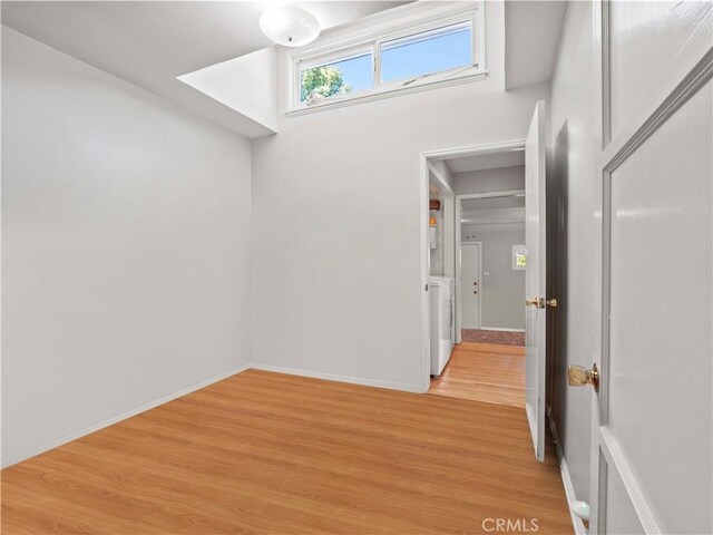 1511 N Maple St, Burbank, CA 91505 - unfurnished room with light wood-style flooring and washing machine and clothes dryer