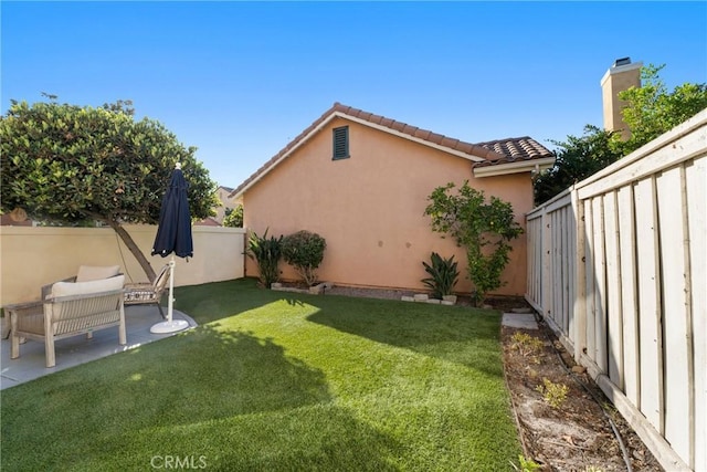 26 Le Vanto, Irvine, CA 92606 - fenced backyard with a patio