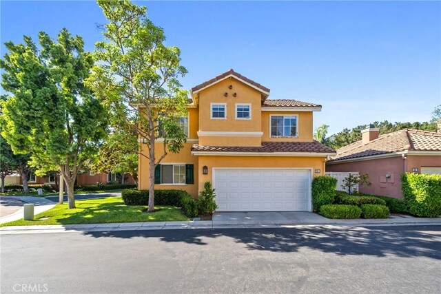 26 Le Vanto, Irvine, CA 92606 - view of front of property featuring a tiled roof, stucco siding, and a garage