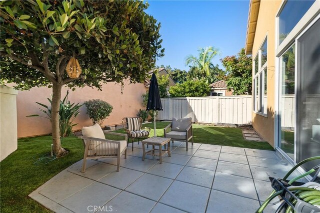 26 Le Vanto, Irvine, CA 92606 - fenced backyard featuring a patio