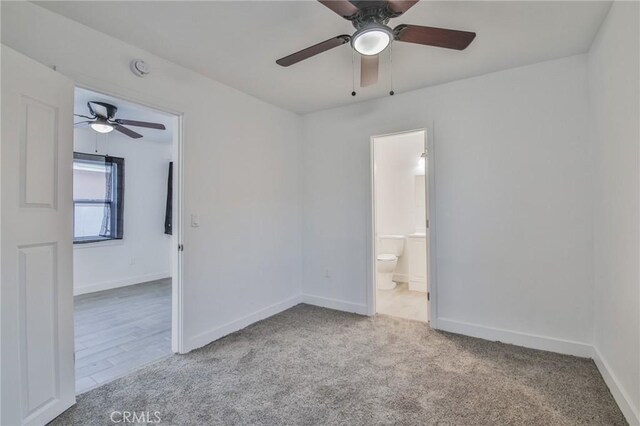 9218 Hooper Ave, Los Angeles, CA 90002 - unfurnished bedroom with carpet flooring, ceiling fan, and ensuite bathroom