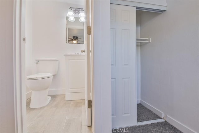 9218 Hooper Ave, Los Angeles, CA 90002 - bathroom with toilet and a ceiling fan
