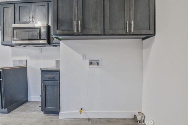 9218 Hooper Ave, Los Angeles, CA 90002 - laundry room featuring washer hookup, gas dryer hookup, and light wood finished floors