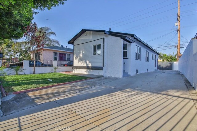 9218 Hooper Ave, Los Angeles, CA 90002 - rear view of house with stucco siding