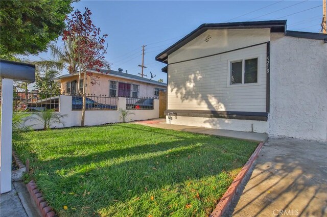 9218 Hooper Ave, Los Angeles, CA 90002 - rear view of property with stucco siding and a patio