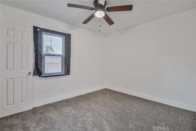 9218 Hooper Ave, Los Angeles, CA 90002 - spare room with dark carpet and a ceiling fan