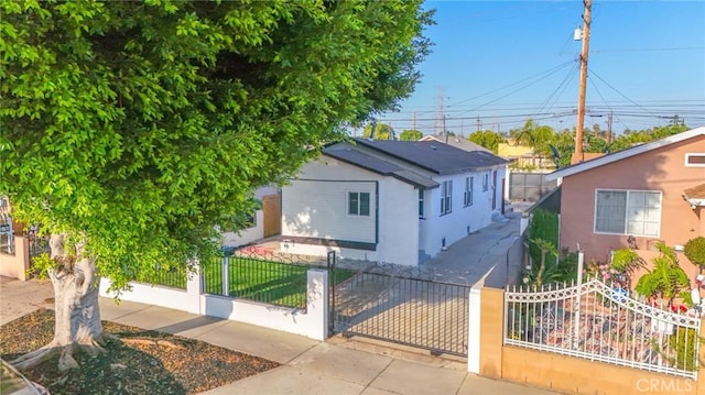 9218 Hooper Ave, Los Angeles, CA 90002 - bungalow with a fenced front yard and stucco siding