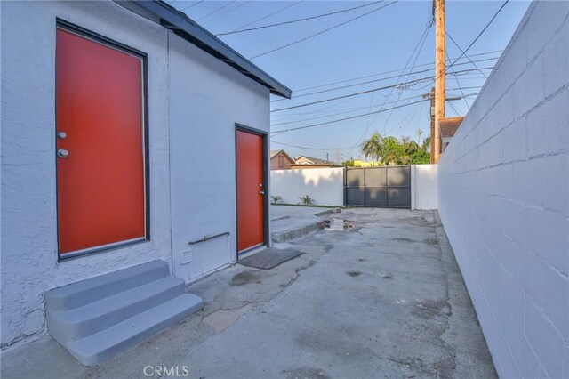 9218 Hooper Ave, Los Angeles, CA 90002 - view of exterior entry with a patio and stucco siding