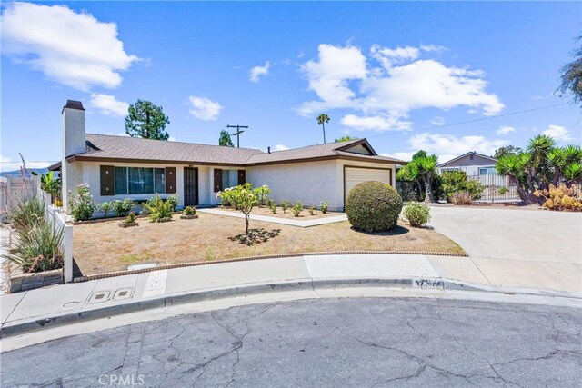 17300 Azalea Ct, La Puente, CA 91744 - ranch-style home featuring an attached garage, concrete driveway, a chimney, and stucco siding