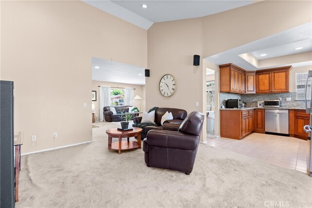17300 Azalea Ct, La Puente, CA 91744 - living room featuring light carpet, high vaulted ceiling, recessed lighting, and light tile patterned floors
