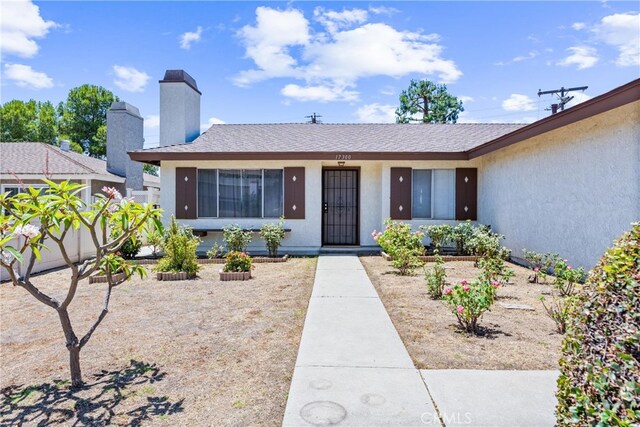 17300 Azalea Ct, La Puente, CA 91744 - view of front of home featuring stucco siding and a chimney