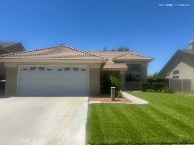 1870 S Jasmin Ct, Loma Linda, CA 92354 - view of front of property featuring a tiled roof, a garage, driveway, a front yard, and stucco siding