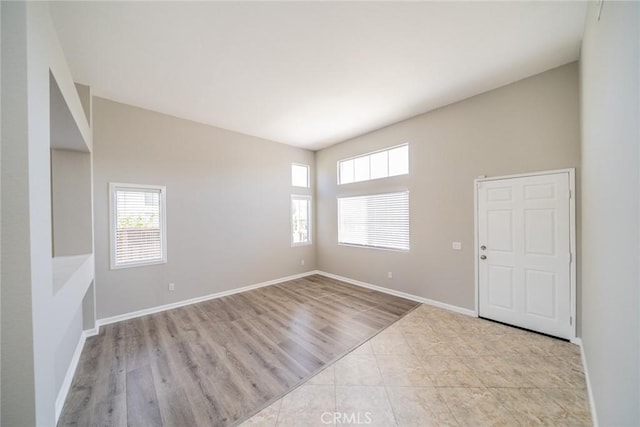1870 S Jasmin Ct, Loma Linda, CA 92354 - spare room with healthy amount of natural light and wood finished floors