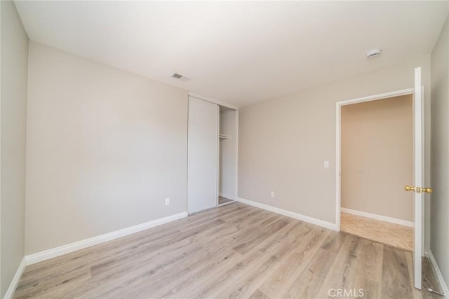 1870 S Jasmin Ct, Loma Linda, CA 92354 - unfurnished bedroom featuring light wood-style floors and a closet
