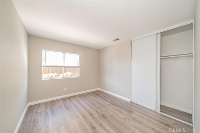 1870 S Jasmin Ct, Loma Linda, CA 92354 - unfurnished bedroom featuring light wood-type flooring and a closet