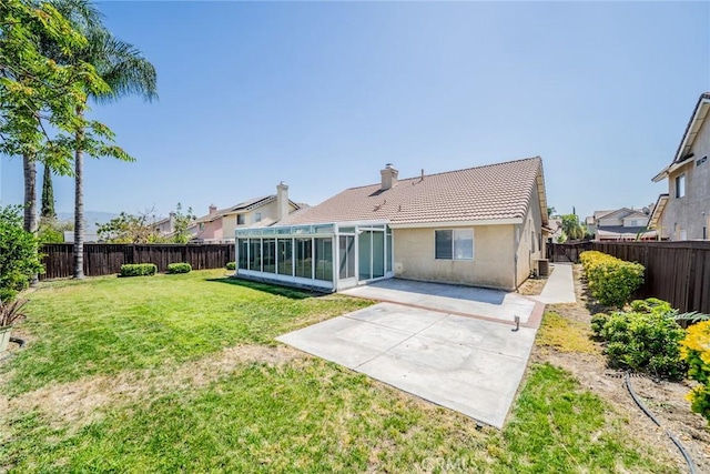 1870 S Jasmin Ct, Loma Linda, CA 92354 - rear view of property with a sunroom, a fenced backyard, a patio, and a tile roof