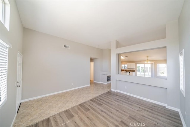 1870 S Jasmin Ct, Loma Linda, CA 92354 - unfurnished living room featuring ceiling fan and wood finished floors