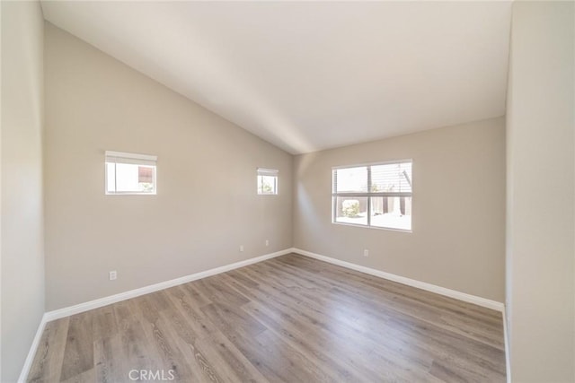 1870 S Jasmin Ct, Loma Linda, CA 92354 - spare room with light wood-type flooring and vaulted ceiling