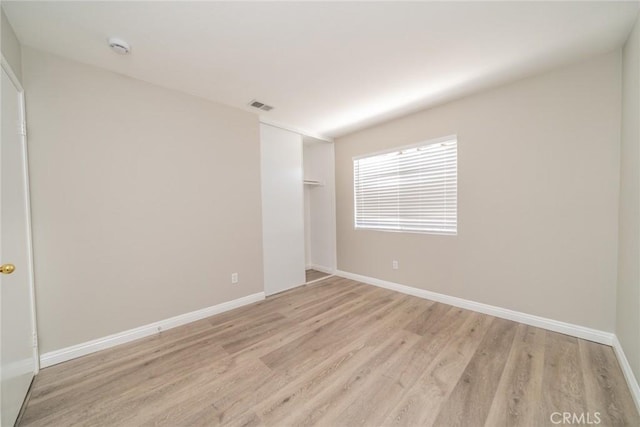 1870 S Jasmin Ct, Loma Linda, CA 92354 - unfurnished bedroom with light wood-style floors and a closet