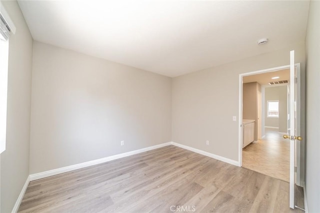 1870 S Jasmin Ct, Loma Linda, CA 92354 - empty room featuring light wood-style floors and a smoke detector