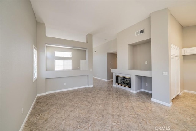 1870 S Jasmin Ct, Loma Linda, CA 92354 - unfurnished living room featuring a tile fireplace and baseboards