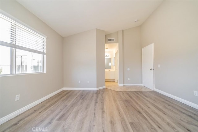 1870 S Jasmin Ct, Loma Linda, CA 92354 - unfurnished room featuring light wood-type flooring and lofted ceiling