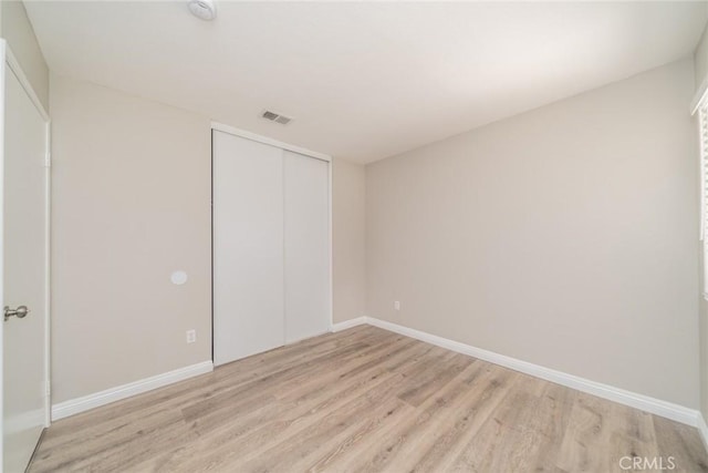 1870 S Jasmin Ct, Loma Linda, CA 92354 - unfurnished bedroom featuring light wood-type flooring and a closet