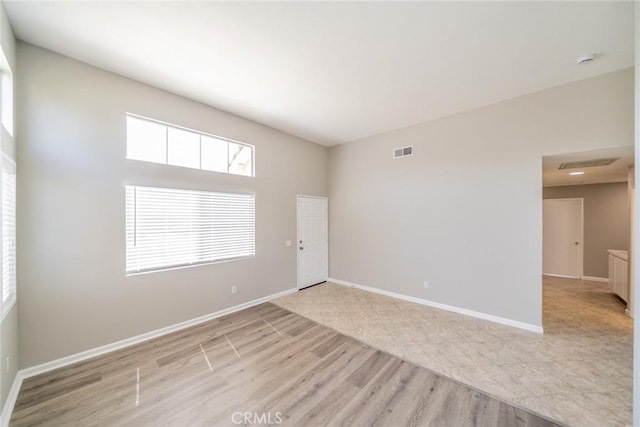1870 S Jasmin Ct, Loma Linda, CA 92354 - unfurnished room with wood finished floors and a smoke detector