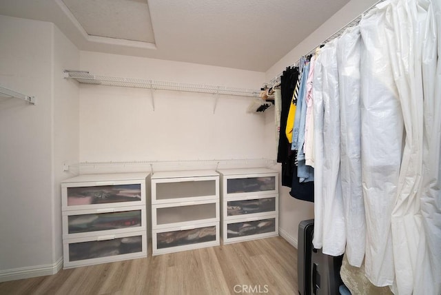27829 Coldsprings Pl, Valencia, CA 91354 - walk in closet with light wood finished floors and attic access