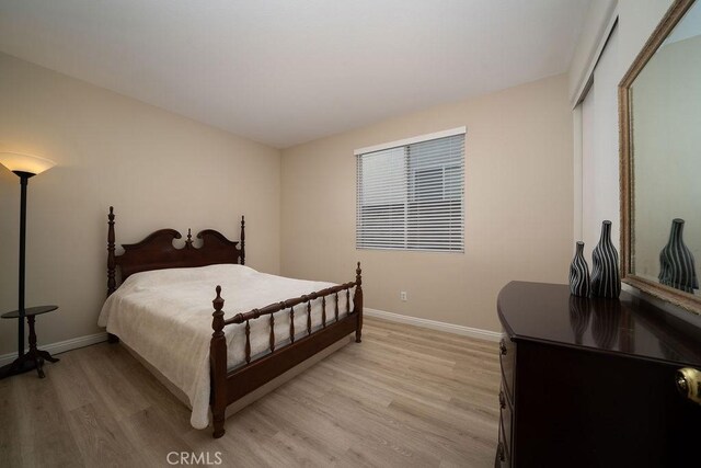 27829 Coldsprings Pl, Valencia, CA 91354 - bedroom with light wood-type flooring and baseboards