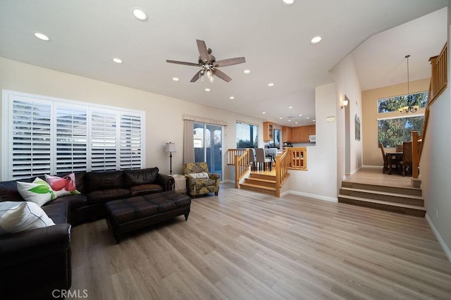 27829 Coldsprings Pl, Valencia, CA 91354 - living room featuring recessed lighting, ceiling fan, light wood finished floors, stairs, and a chandelier
