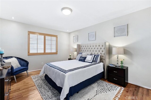 16728 Los Alimos St, Granada Hills, CA 91344 - bedroom featuring light wood-style floors and baseboards