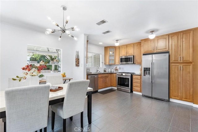 16728 Los Alimos St, Granada Hills, CA 91344 - kitchen with stainless steel appliances, a chandelier, and glass insert cabinets