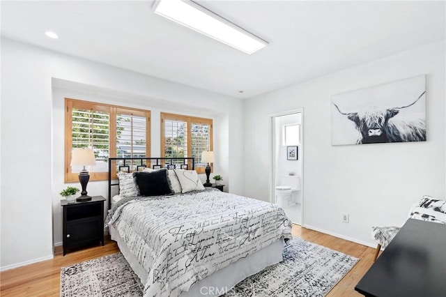 16728 Los Alimos St, Granada Hills, CA 91344 - bedroom featuring light wood-style flooring and connected bathroom