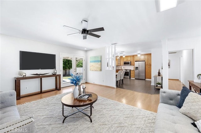 16728 Los Alimos St, Granada Hills, CA 91344 - living room featuring ceiling fan, light wood-style flooring, and french doors