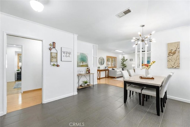 16728 Los Alimos St, Granada Hills, CA 91344 - dining area featuring a chandelier and baseboards