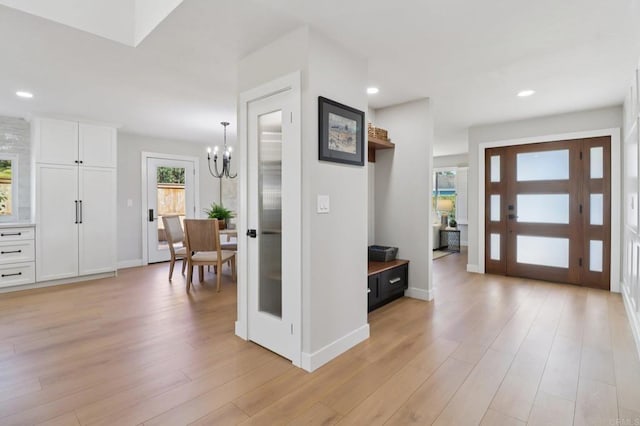 1358 Walnutview Dr, Encinitas, CA 92024 - entrance foyer featuring a chandelier, light wood finished floors, and recessed lighting
